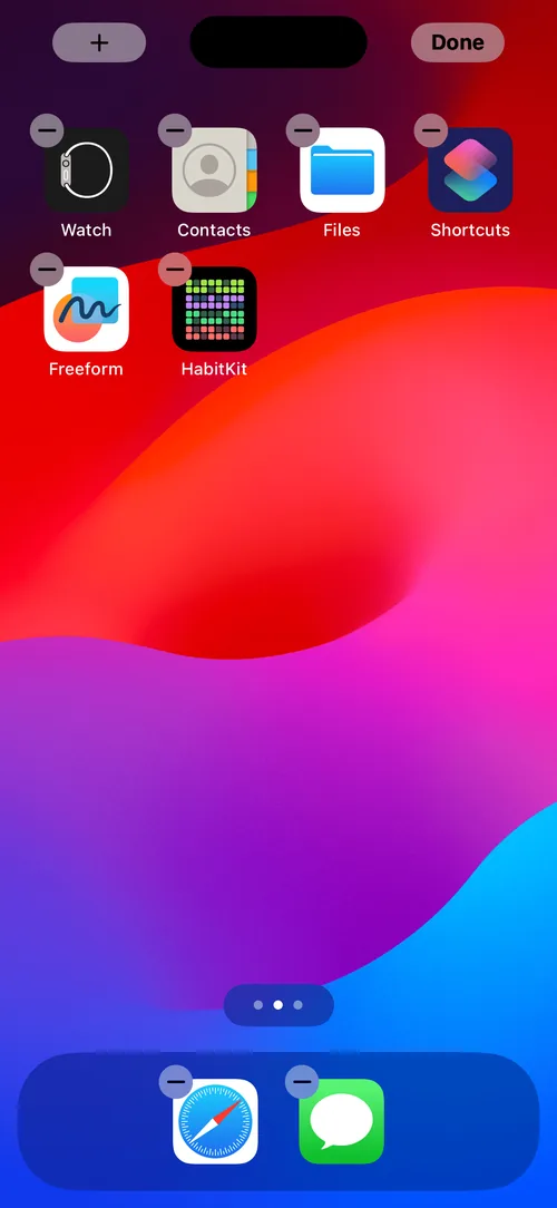 iOS home screen in edit mode with app icons